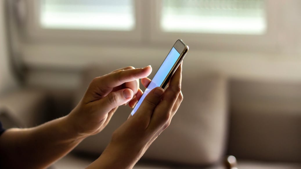 Woman using cell phone.